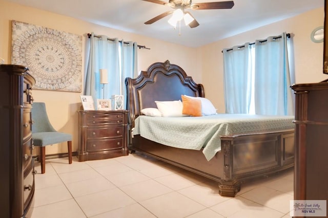 tiled bedroom with ceiling fan