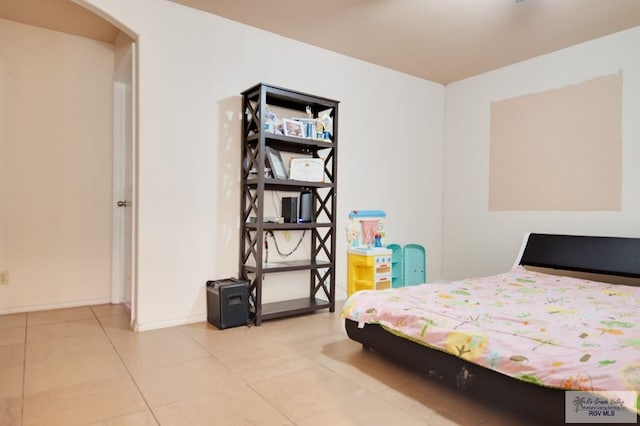 bedroom featuring light tile patterned flooring