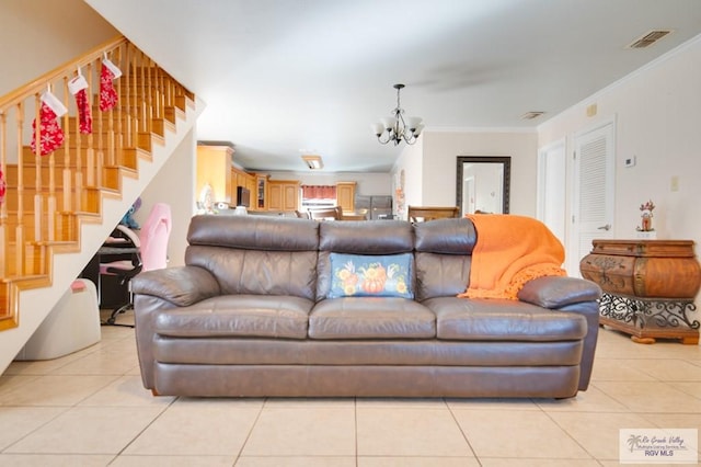 living room with light tile patterned floors, an inviting chandelier, and crown molding