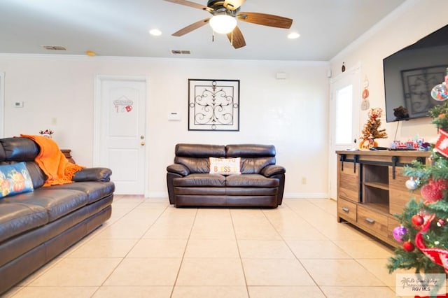 tiled living room featuring ceiling fan and ornamental molding