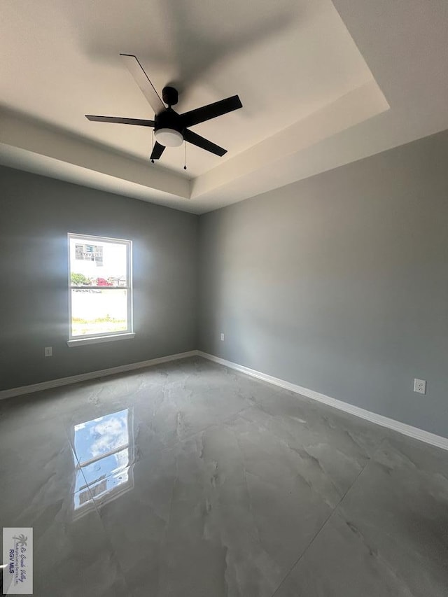 9910 Hawk Dr, Harlingen, TX 78550 - unfurnished room with a tray ceiling and ceiling fan