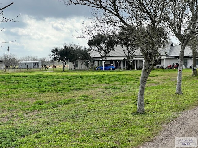 view of yard featuring a carport