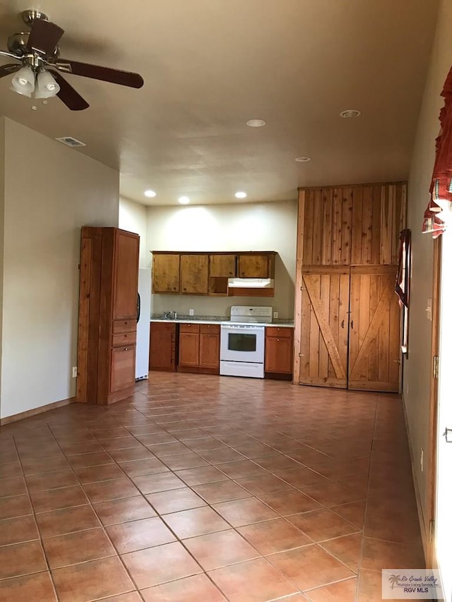 kitchen with white electric range, ceiling fan, and light tile patterned flooring