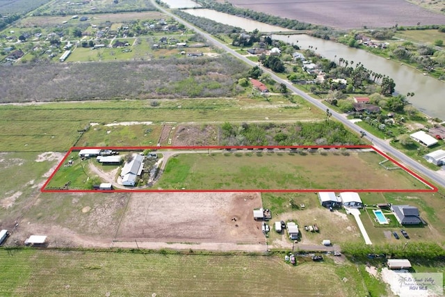 aerial view featuring a rural view and a water view