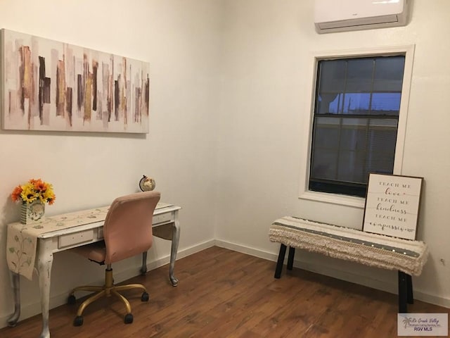 office space with dark wood-type flooring and a wall unit AC