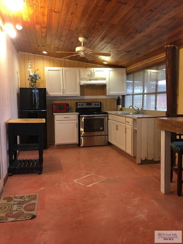 kitchen featuring stainless steel electric range oven, white cabinetry, sink, wood ceiling, and black fridge