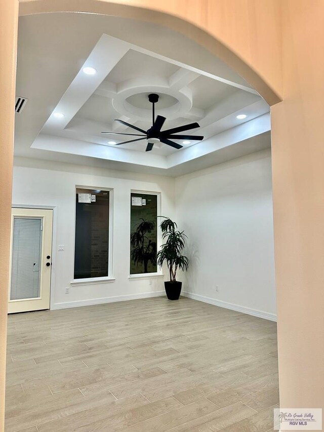 1521 Stirrup Cir, San Benito, TX 78586 - empty room featuring coffered ceiling, a ceiling fan, light wood-style flooring, baseboards, and recessed lighting