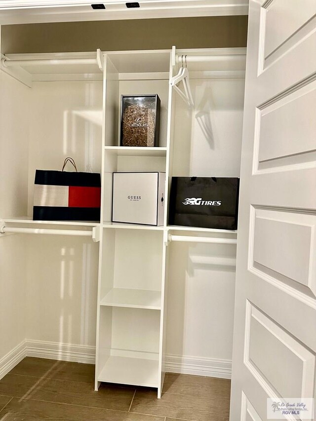 1521 Stirrup Cir, San Benito, TX 78586 - spacious closet featuring wood finished floors