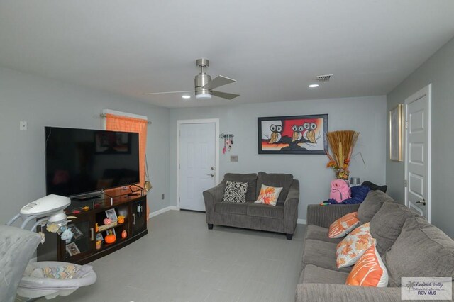 living room featuring ceiling fan