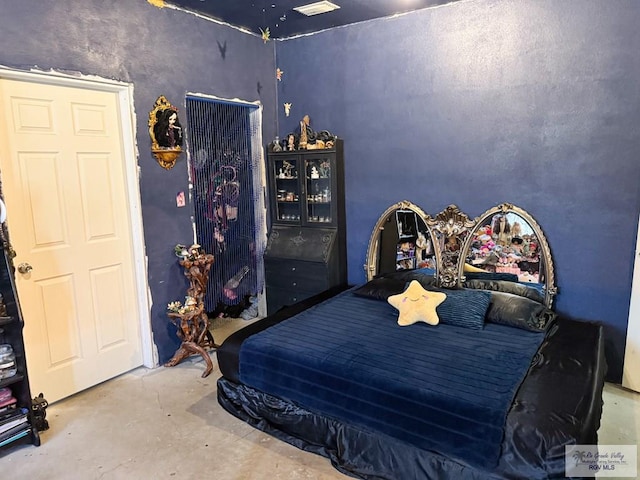 bedroom with concrete flooring