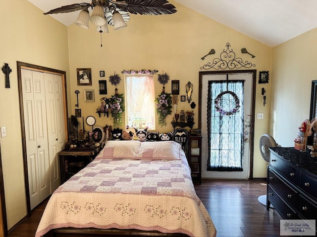 bedroom with a closet, ceiling fan, dark hardwood / wood-style flooring, and vaulted ceiling