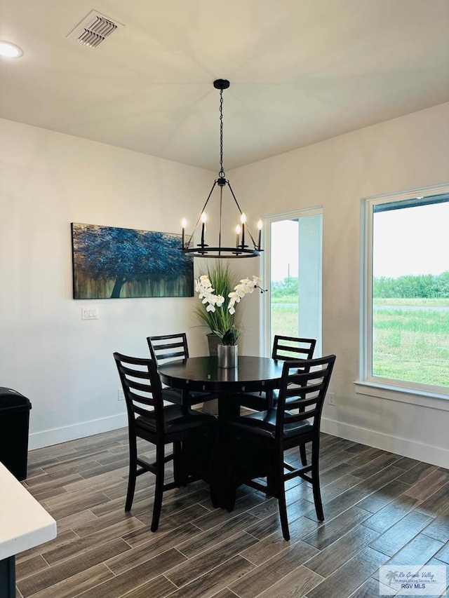 3518 Treasure Hills Blvd, Harlingen, TX 78550 - dining space featuring a chandelier and dark wood-style floors