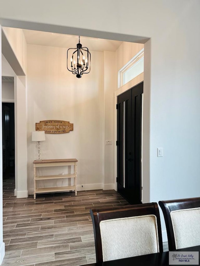 3518 Treasure Hills Blvd, Harlingen, TX 78550 - foyer entrance featuring wood finish floors and a chandelier