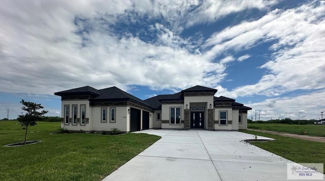 3518 Treasure Hills Blvd, Harlingen, TX 78550 - prairie-style home featuring an attached garage, concrete driveway, and a front yard