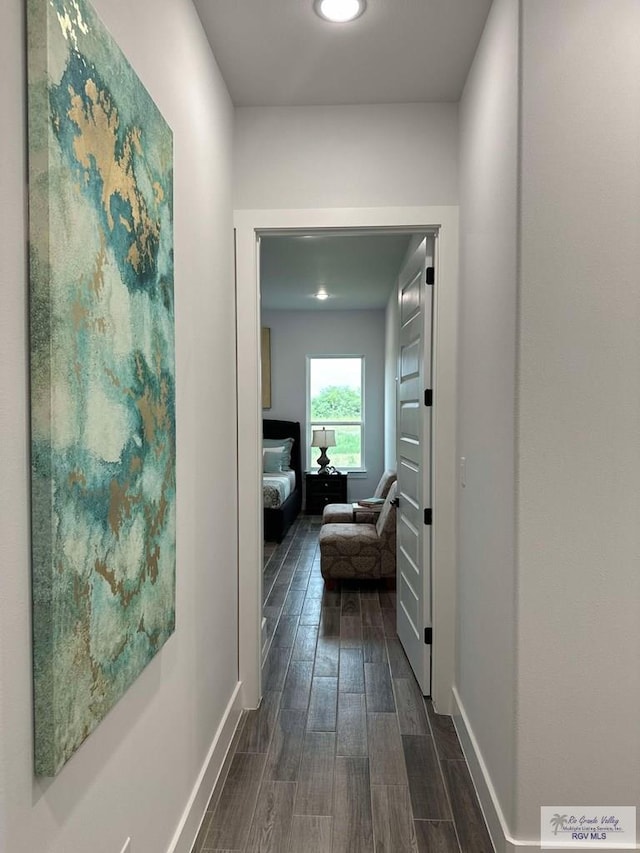 3518 Treasure Hills Blvd, Harlingen, TX 78550 - corridor featuring dark wood-style flooring and baseboards