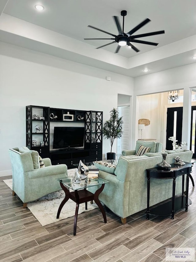 3518 Treasure Hills Blvd, Harlingen, TX 78550 - living room with wood finished floors, a ceiling fan, recessed lighting, and a raised ceiling