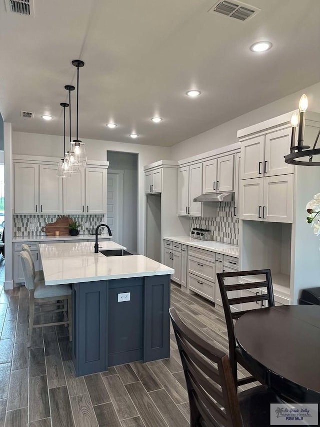 3518 Treasure Hills Blvd, Harlingen, TX 78550 - kitchen with tasteful backsplash, recessed lighting, light countertops, and dark wood-type flooring