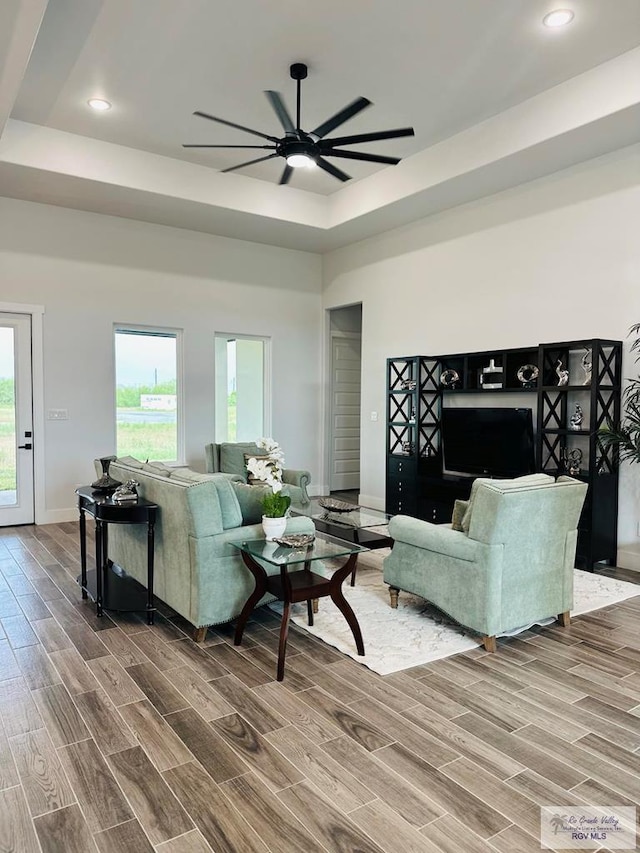 3518 Treasure Hills Blvd, Harlingen, TX 78550 - living area with ceiling fan, wood finished floors, a tray ceiling, and recessed lighting