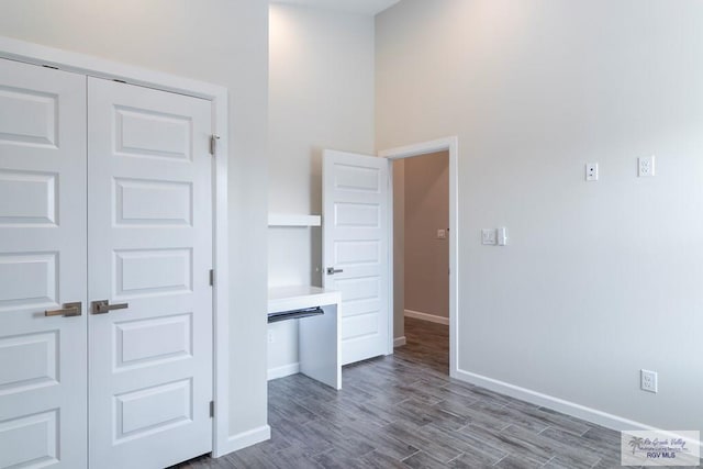 corridor featuring dark wood-type flooring