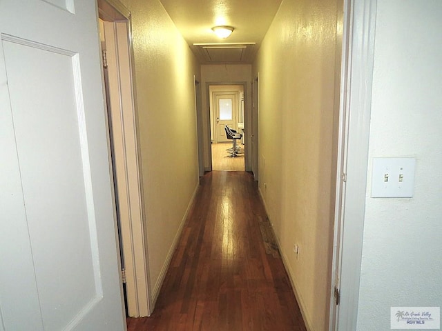 corridor featuring dark hardwood / wood-style floors