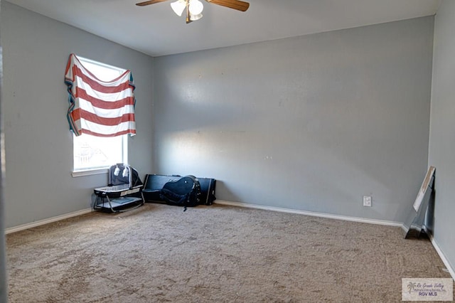 sitting room with carpet floors and ceiling fan