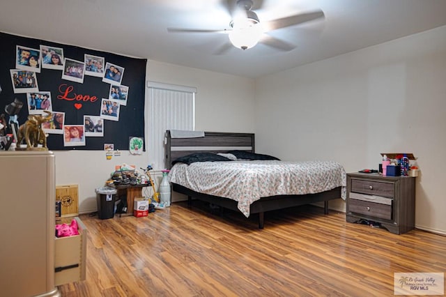 bedroom with hardwood / wood-style floors and ceiling fan