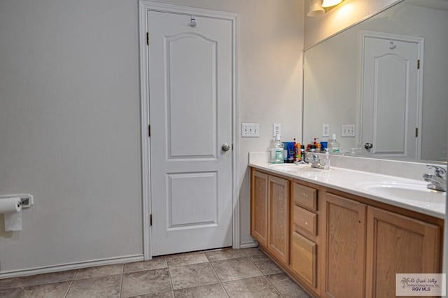 bathroom with vanity and tile patterned floors