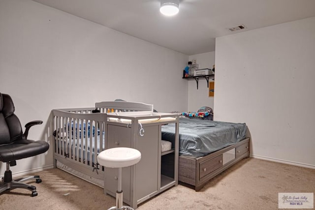 bedroom with light colored carpet