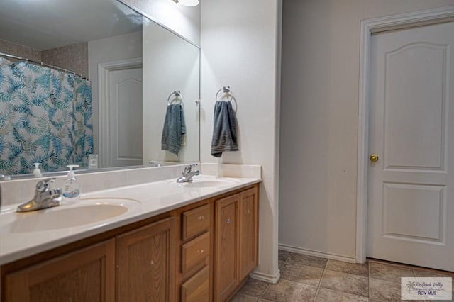 bathroom with vanity, tile patterned floors, and a shower with curtain