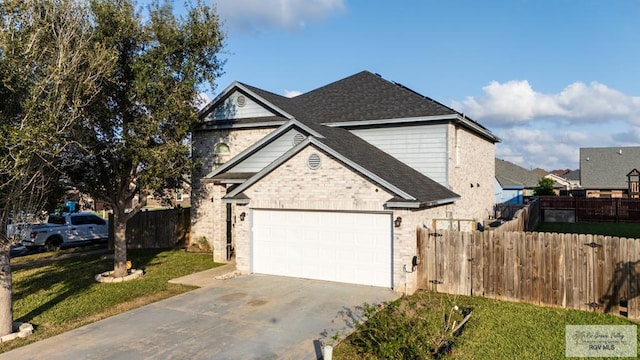 view of front of home featuring a garage and a front lawn