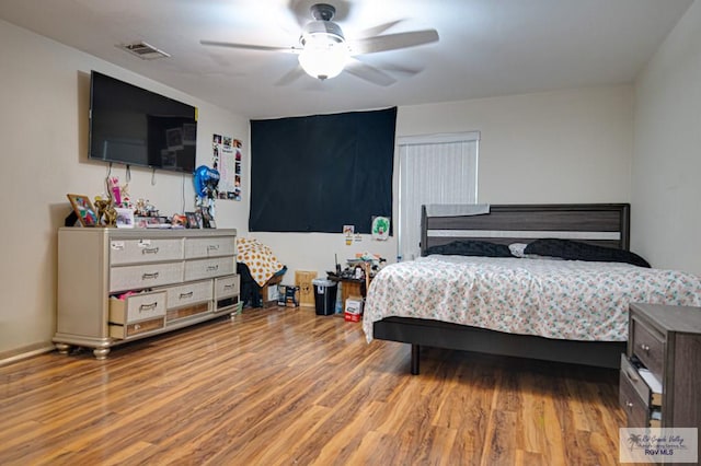 bedroom featuring ceiling fan and light hardwood / wood-style floors