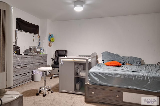 bedroom with light colored carpet