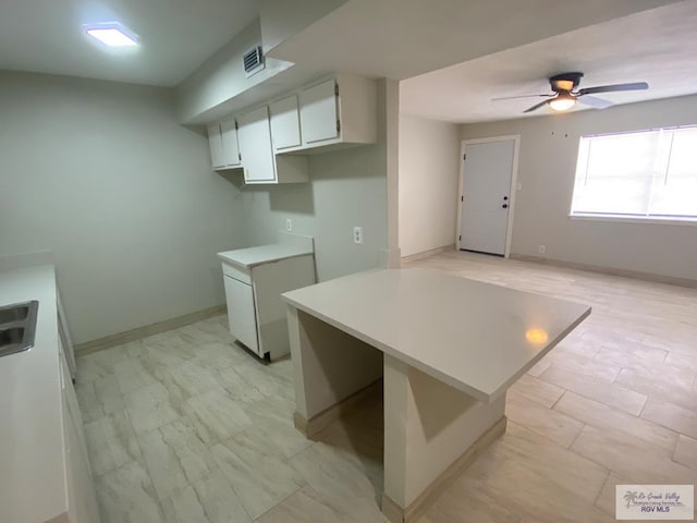2304 Shidler Dr Unit 10-40, Brownsville, TX 78521 - kitchen featuring ceiling fan, light countertops, and white cabinets