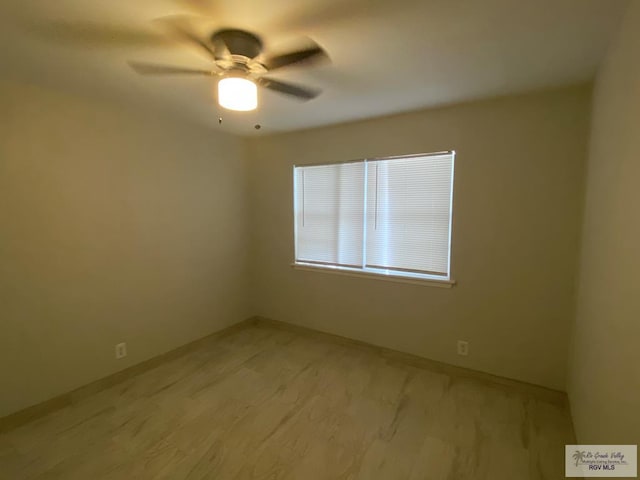 2304 Shidler Dr Unit 10-40, Brownsville, TX 78521 - empty room featuring a ceiling fan and baseboards