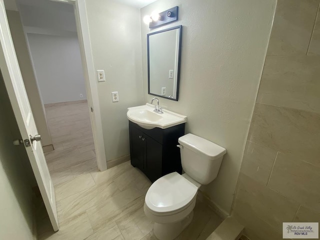2304 Shidler Dr Unit 10-40, Brownsville, TX 78521 - bathroom featuring vanity and toilet