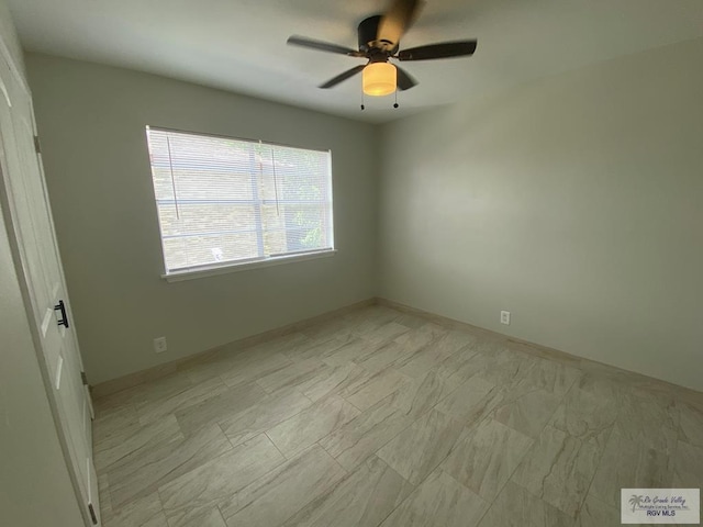 2304 Shidler Dr Unit 10-40, Brownsville, TX 78521 - empty room featuring ceiling fan and baseboards