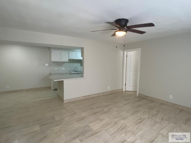 2304 Shidler Dr Unit 10-40, Brownsville, TX 78521 - unfurnished living room with ceiling fan and a sink