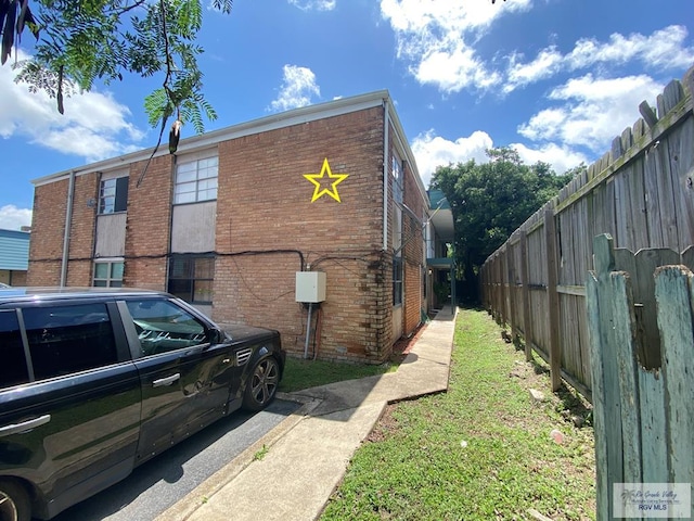 2304 Shidler Dr Unit 10-40, Brownsville, TX 78521 - view of side of home featuring brick siding