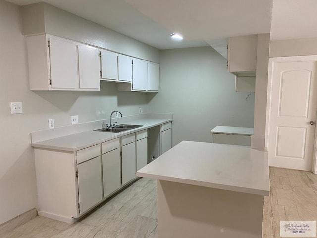 2304 Shidler Dr Unit 10-40, Brownsville, TX 78521 - kitchen with light countertops, white cabinetry, and recessed lighting