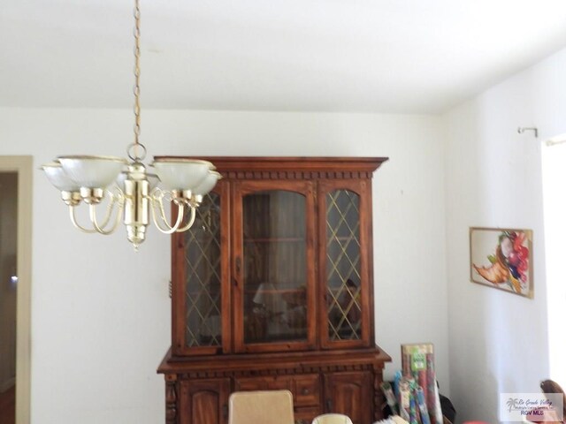 55 Carlton Dr, Brownsville, TX 78521 - dining area with a chandelier