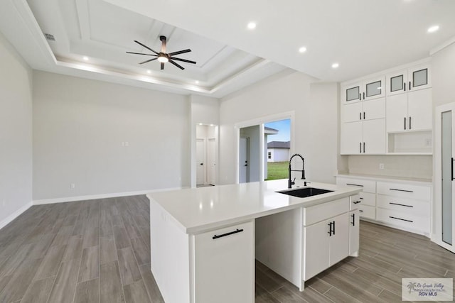 516 Eagle Dr, Los Fresnos, TX 78566 - kitchen with light wood-style flooring, a sink, recessed lighting, ceiling fan, and an island with sink