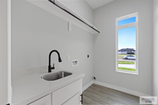 516 Eagle Dr, Los Fresnos, TX 78566 - laundry room with a sink, hookup for an electric dryer, plenty of natural light, hookup for a washing machine, and laundry area