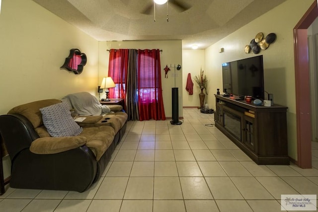 living room featuring light tile patterned floors and ceiling fan