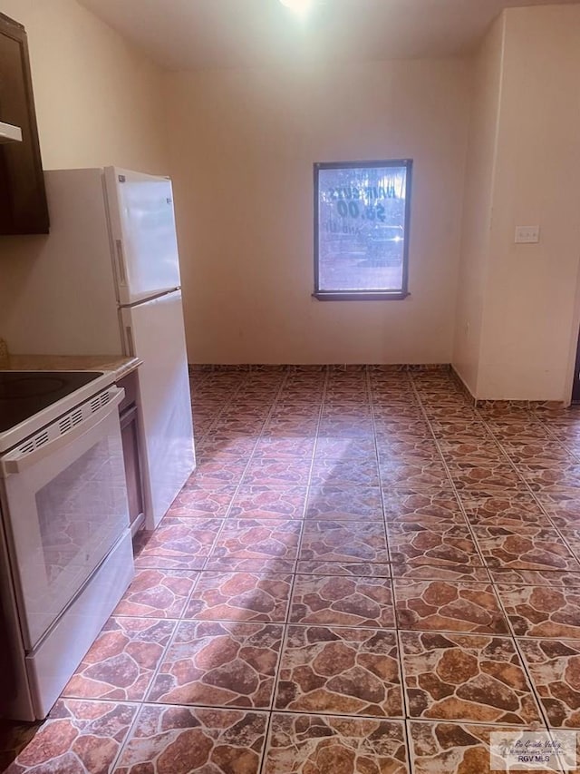 144 N St, Brownsville, TX 78521 - kitchen with white electric range oven