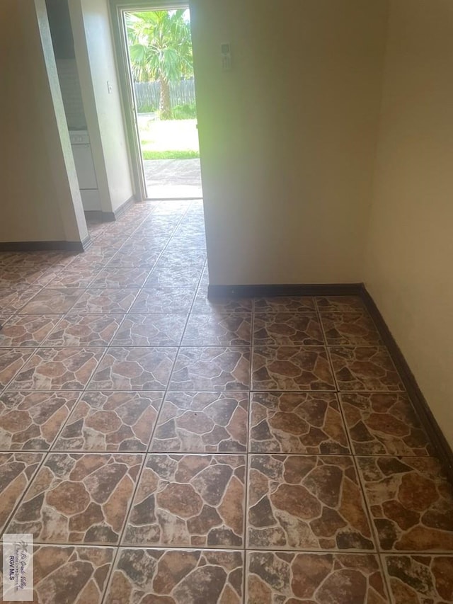 144 N St, Brownsville, TX 78521 - hallway with baseboards and stone finish floors