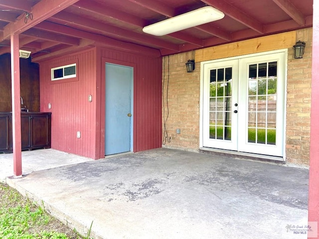 interior space featuring french doors and a patio area