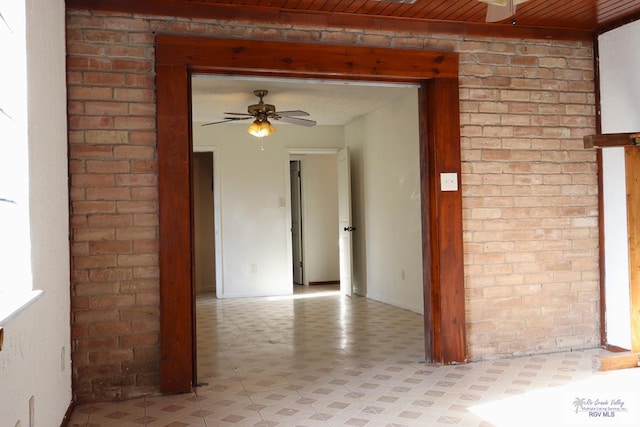 spare room with ceiling fan and wooden ceiling