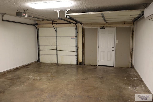 garage with a wall unit AC and a garage door opener