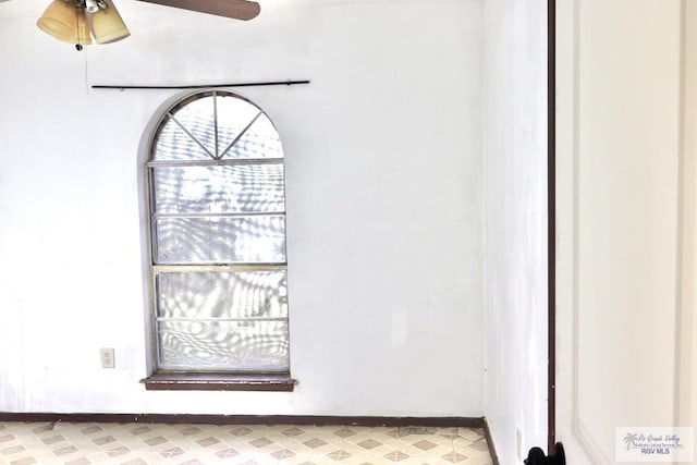 interior details featuring ceiling fan