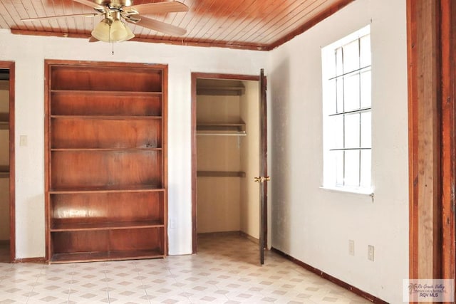 unfurnished bedroom featuring ceiling fan, wooden ceiling, and ornamental molding